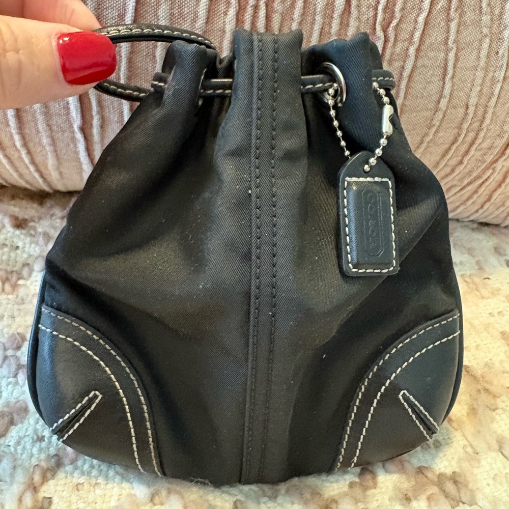 Vintage Coach 8669 mini drawstring bag.